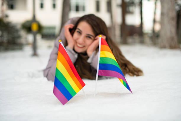 istock Defocused Brunette Woman and Rainbow Flag 1201306741