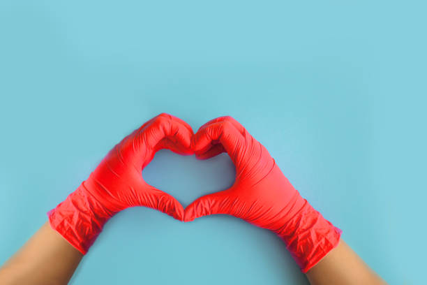 istock Human holding Variation of Latex Glove, Rubber glove 1201307563
