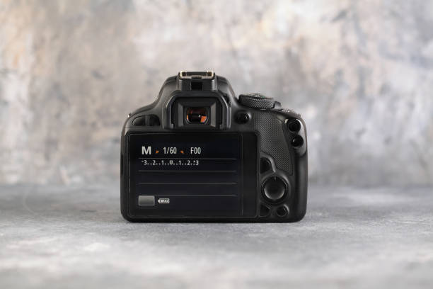 istock DSLR Digital Camera APS-C sensor of A EOS Canon 100D on gray cement background. 1201309108