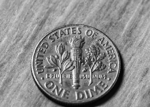 Us Dollar. Coin Bank, One Dime. Photograph of a group of American dimes.