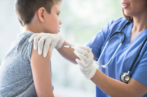 istock Young Boy Receiving an Immunization Needle stock photo 1201311282