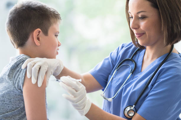 istock Young Boy Receiving an Immunization Needle stock photo 1201311290