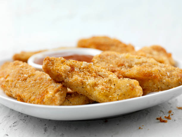 istock Vegan, Meatless-Plant Based Protein Chicken Strips with a Seven Grain Coating and Fries 1201312438