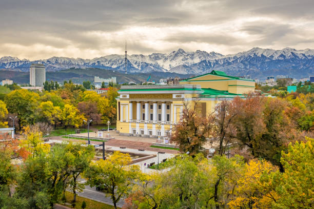 Cityscape of Almaty Kazakhstan with Abay National Opera House Cityscape of Almaty Kazakhstan with the landmark Abay National Opera House and the Ile Alatau Mountains in the background. almaty photos stock pictures, royalty-free photos & images