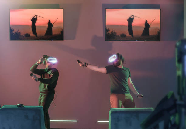 istock Gamers playing VR fighting game at futuristic visitor centre 1201313790