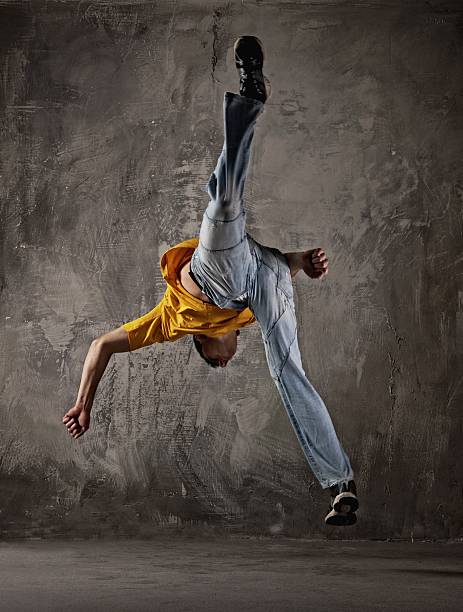 istock Young man jumping against grunge wall 120131406