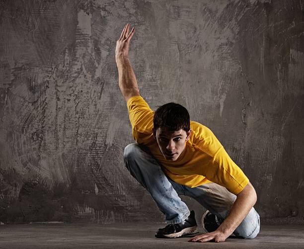 istock Young man dancing against grunge wall 120131410