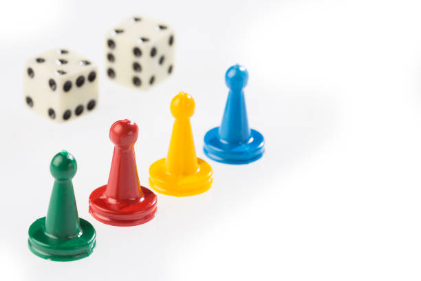 istock game pieces with dice isolated on white background 1201316668