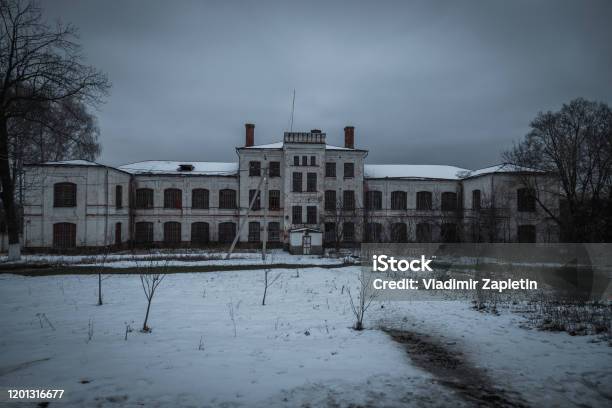 Dark And Creepy Abandoned Haunted Mental Hospital In Winter Stock Photo - Download Image Now