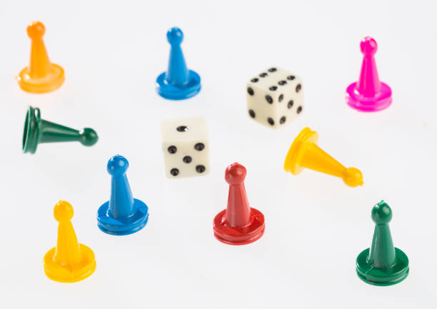istock Colorful game pieces and dice 1201316765