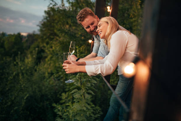 We could stay like this forever An affectionate young couple spending time together at the terrace and enjoying the view couple drinking stock pictures, royalty-free photos & images