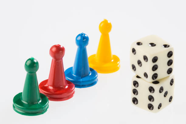 istock Colorful game pieces and dice 1201317042