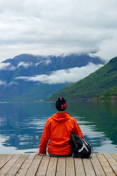 istock Men looking at fjord and mountain range .Norway 1201317322