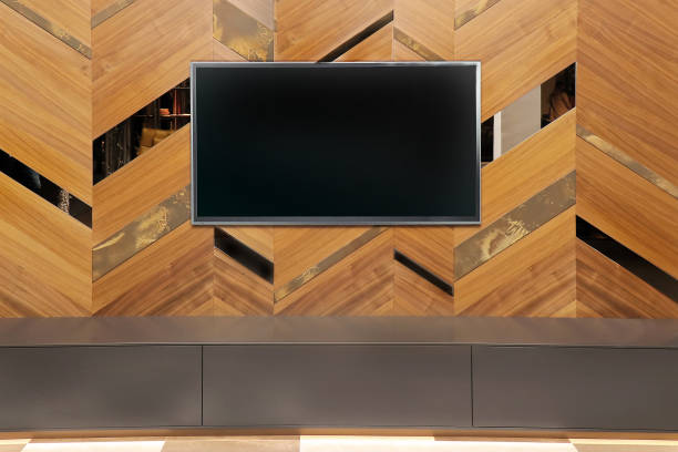 istock Large TV on wooden wall 1201318325