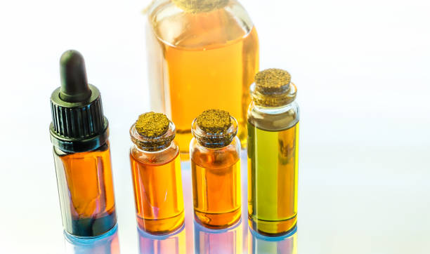 istock Glass bottles with Cannabis CBD and THC oils on white background 1201323201