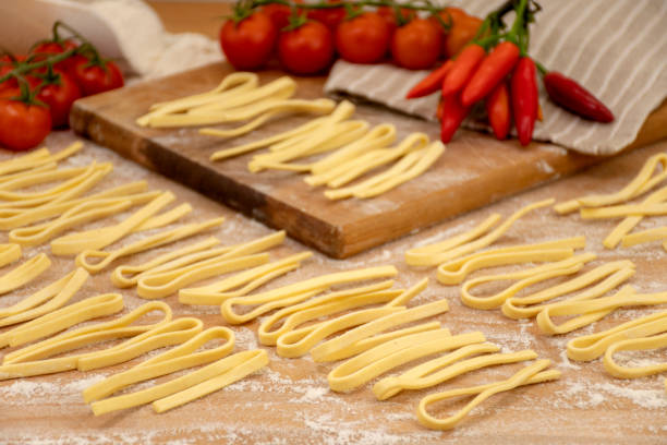 Scialatielli, fresh pasta typical of the Amalfi Coast Scialatielli are a typical pasta format of Campania cuisine and in particular of the city of Amalfi amalfi food stock pictures, royalty-free photos & images
