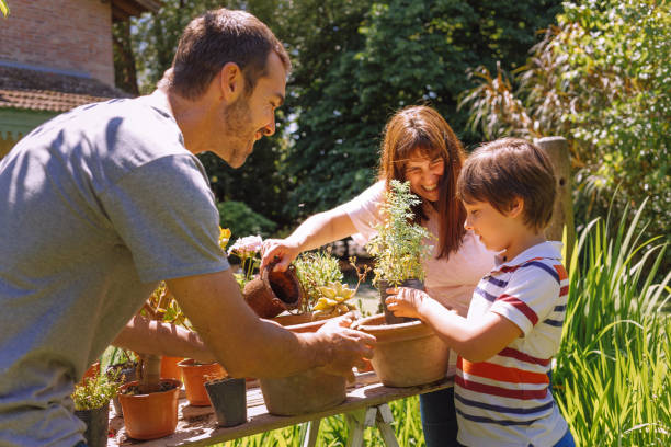 istock parents teach their child to garden 1201331378