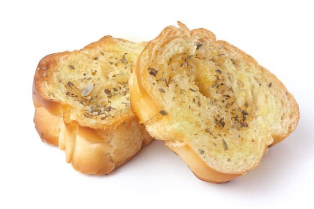 sliced homemade toasted herb bread isolated over white background