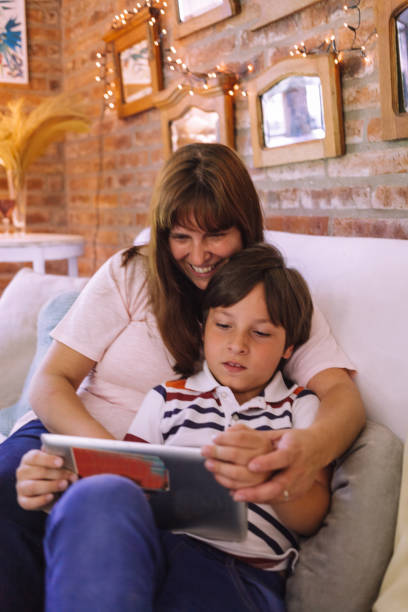 istock a mother and child playing with a tablet 1201333256
