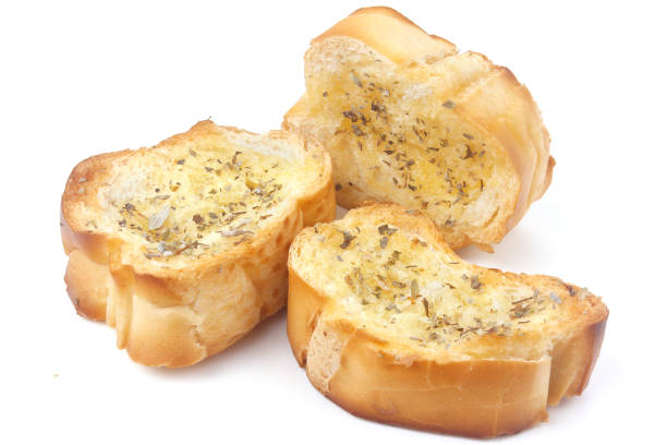 sliced homemade toasted herb bread isolated over white background