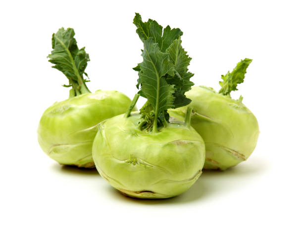 fresh kohlrabi with green leaves - kohlrabi turnip kohlrabies cabbage imagens e fotografias de stock