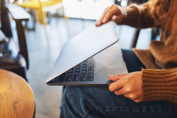 istock a woman close or open a laptop computer 1201334232