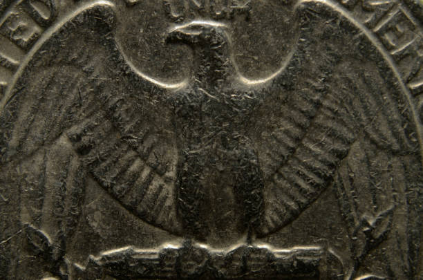 istock Tails: American eagle from the back of an old, damaged, US quarter. 1201335064
