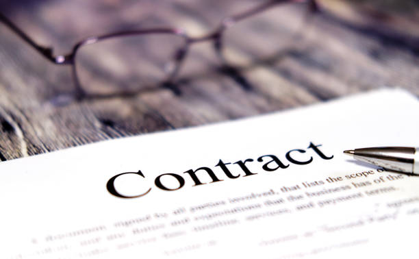 istock Financial contrak and pen. Points lie next to each other 1201336326