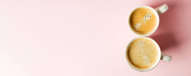 istock Couple white cups with coffee on pink pastel background, 8 march celebration minimal concept. Copy space, banner for sale, flyer, coupon, womans day 1201342611