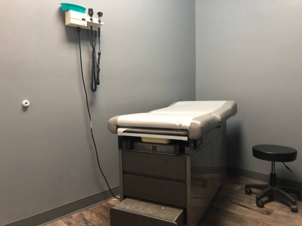 istock Patient Exam Room with Doctor's Chair 1201345458