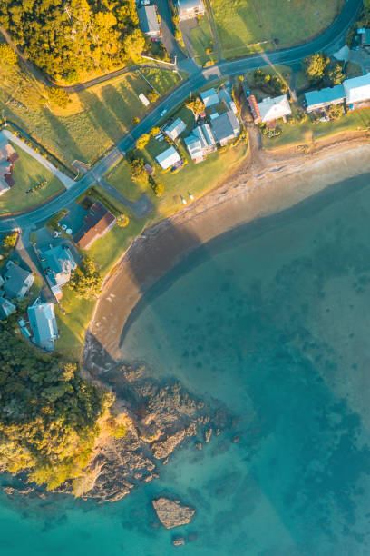 istock Aerial abstract houses next to beach. 1201350226