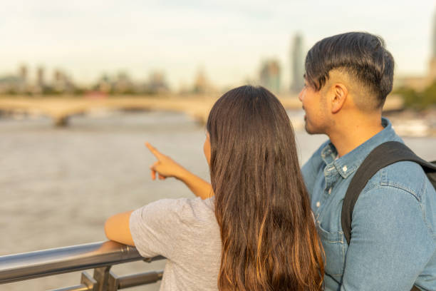 istock Romantic Young Asian Couple Sightseeing 1201351972