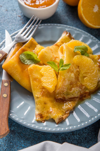 istock Thin crepes suzette with orange slices and marmalade for breakfast 1201353196