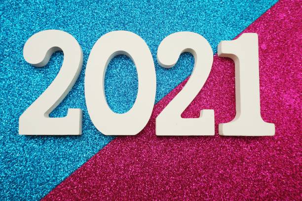 istock 2021 Happy New Year with space copy on blue and purple glitter background 1201353252
