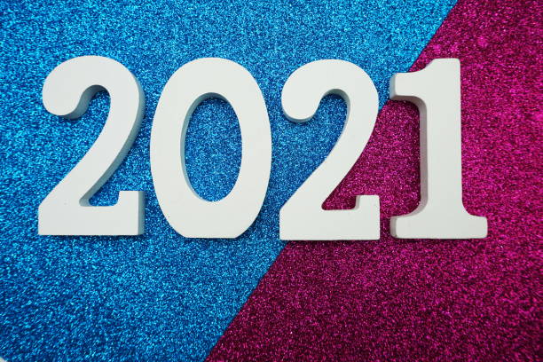 istock 2021 Happy New Year with space copy on pink and blue glitter background 1201353259