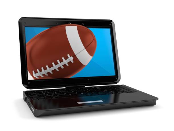 istock Rugby ball with laptop isolated 1201353345