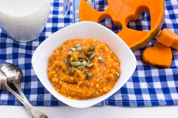 Pumpkin oatmeal with yogurt and pumpkin seeds for breakfast