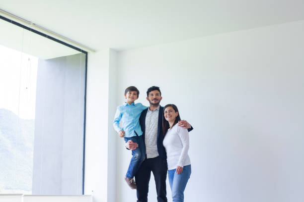 istock Happy family inside their new house 1201354307