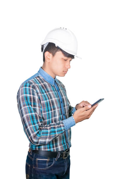 istock Businessman engineer thinking command with cell phone with a 5g network, high-speed mobile Internet. and wear white safety helmet plastic. future  technology concept  on white background 1201356778