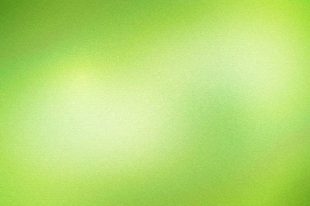 istock Light green foil metal wall with glowing shiny light, abstract texture background 1201358372