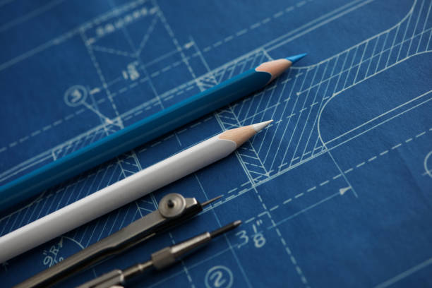 Drawing tools lying over blueprint paper Drawing tools lying over blueprint paper close-up measuring photos stock pictures, royalty-free photos & images