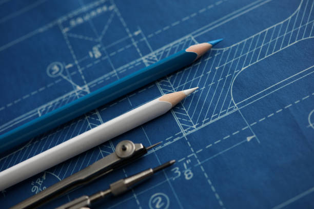 drawing tools lying over blueprint paper - schematic drawing imagens e fotografias de stock