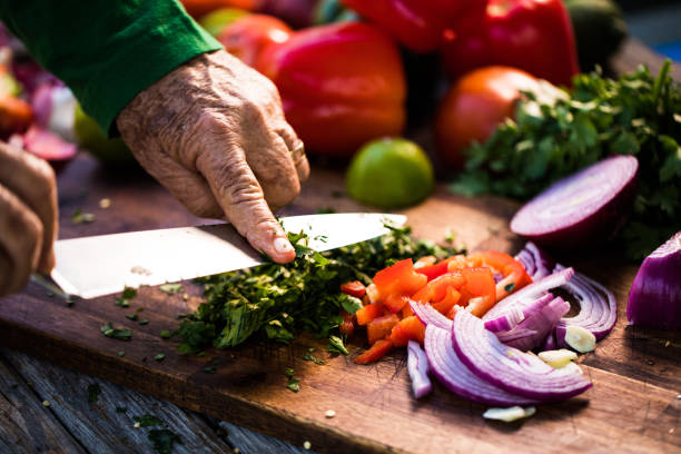 istock Senior man chopping parsley 1201362100