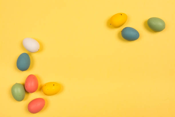istock Easter holiday background. Coloured decorated easter eggs on a bright yellow background 1201363183