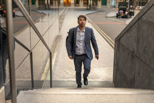 istock Businessman Walking on Stairs 1201363360