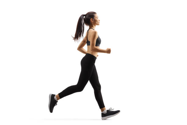 young woman jogging - running women jogging profile imagens e fotografias de stock