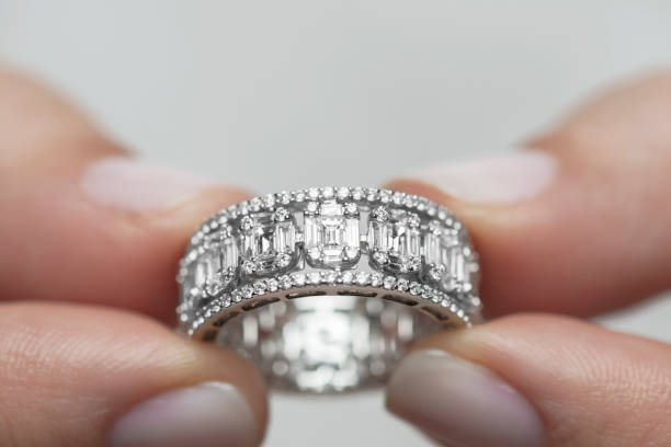 istock Woman Holding A Diamond Ring 1201367912
