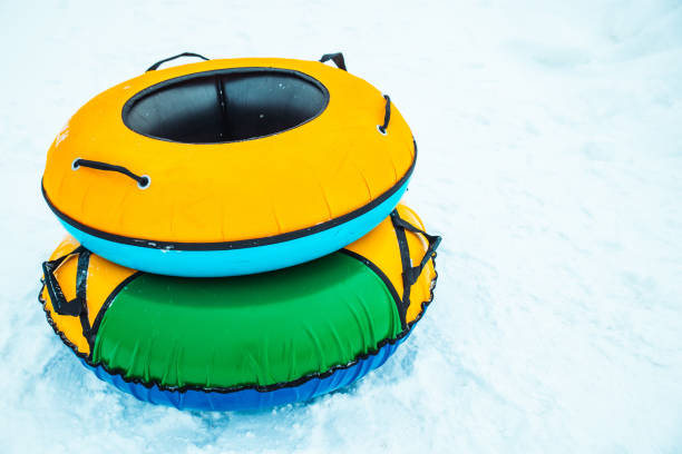 istock snow tubing rings close up. hill on background 1201373698
