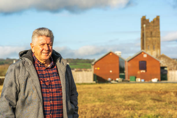 istock Senior man standing on wasteland 1201374343