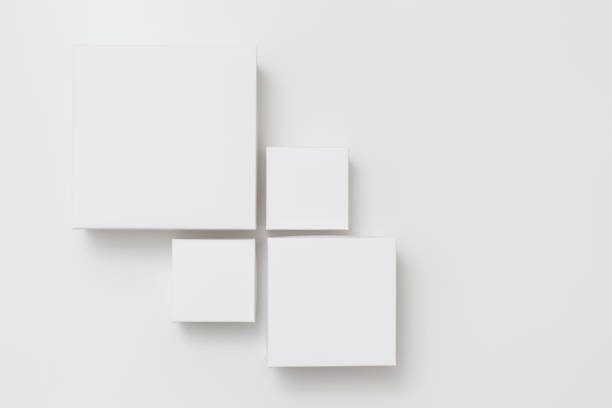 istock Mock up of four different size white boxes on the white background 1201374405